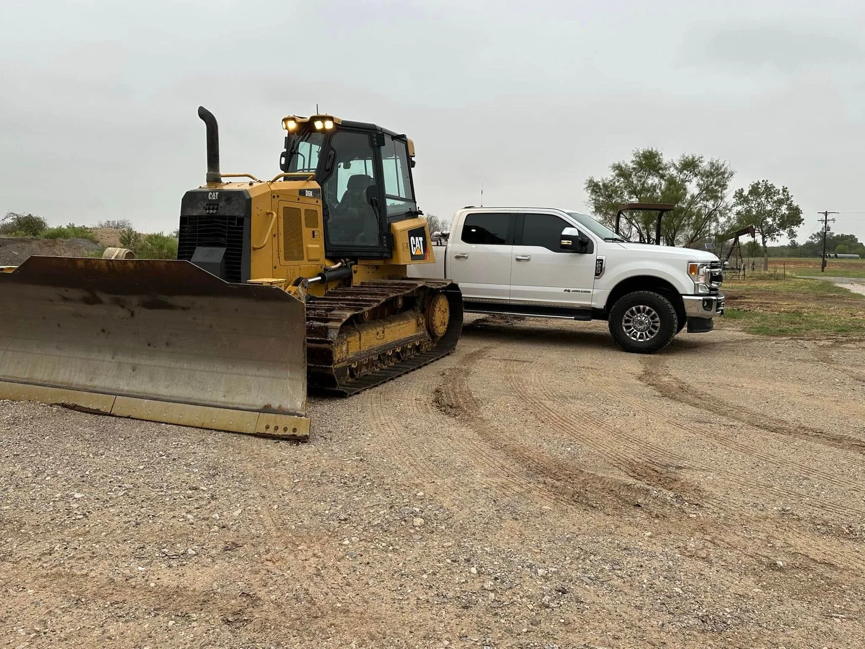 Heavy excavation equipment and crew ready for land clearing and dirt work operations.